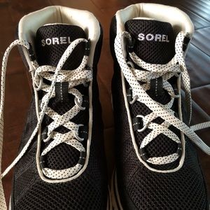 Black and white SOREL boots